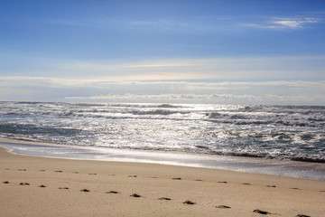 Beautiful ocean waves on the sand beach.