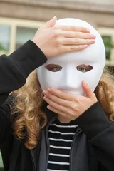 Fotobehang Girl with white mask. Expression of surprise. Something has happened © Aitor Diago