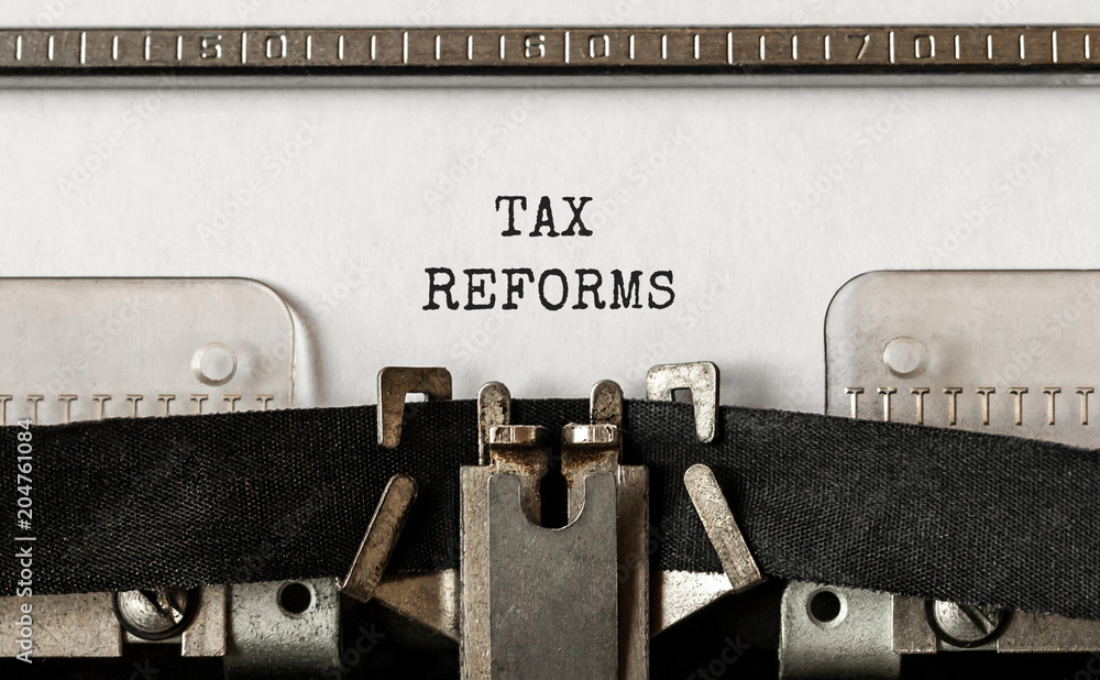Poster text tax reforms typed on retro typewriter