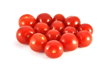 Red tomatoes on white background closeup 