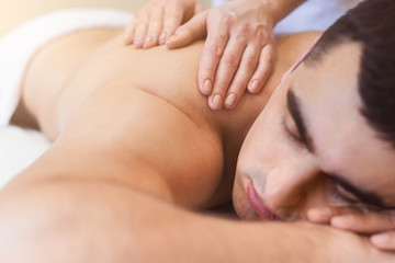 Obraz na płótnie Canvas Classical body massage at physiotherapist office