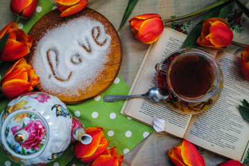 A cup of tea and flowers