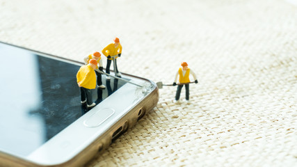 figurine model repair mobile crash with repairman