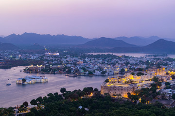 Udaipur city at lake Pichola in the evening, Rajasthan, India. View from  the mountain viewpoint...