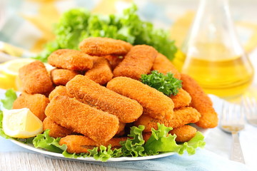Fried chicken sticks nuggets on table