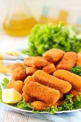 Fried chicken sticks nuggets on table