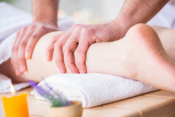 Fototapeta na wymiar Foot massage in medical spa