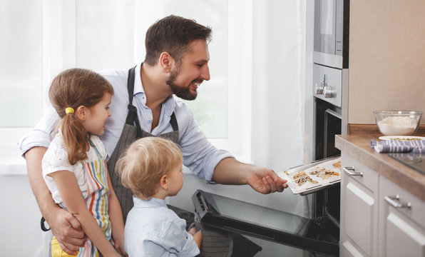 father with children   baking cookies
