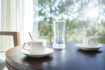 Two coffee cups on table near windows morning romantic love concept. Vacation holiday concept.