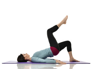 Mother woman exercising doing postnatal workout. Female fitness instructor holds legs in gym and...