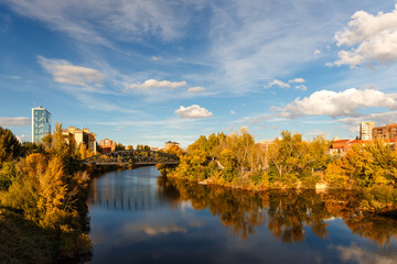 Fototapeta na wymiar Iron bridge over Pisuerga River in Valladolid, Spain