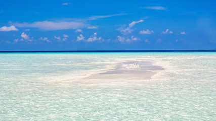 Tiny island ocean beach on Maldives