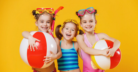 funny funny happy children  jumping in swimsuit  jumping  on colored background