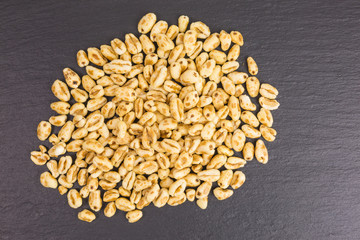 heap of puffed wheat cereal with honey