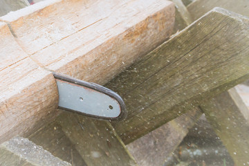 Cut logs for firewood with a chain saw