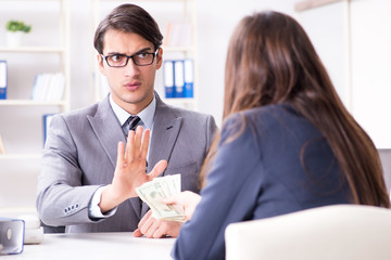 Businessmanbeing offered bribe for breaking law