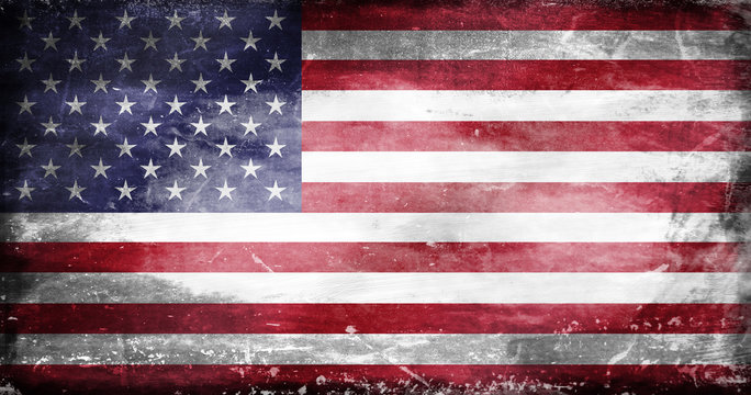 US flag with traces of use in battle and destruction from difficult warfare
