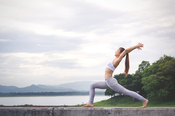 Asia woman doing yoga fitness exercise