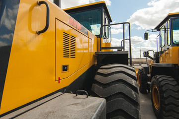 Excavator Loader Machine. Side View of Front Hoe Loader. Industrial Vehicle. Heavy Equipment Machine. Pneumatic Truck. Construction Equipment