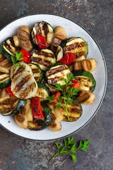 Salad with grilled vegetables and mushrooms. Vegetable salad with grilled champignons. Grilled salad on plate
