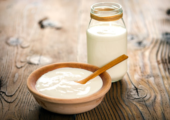 Healthy yogurt in the wooden bowl