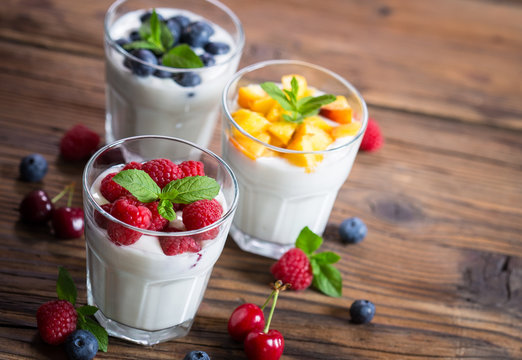 Fresh fruit yogurt with fresh berries and peaches
