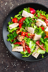 Salad with meat. Fresh vegetable salad with baked meat. Meat salad with fresh vegetables on plate