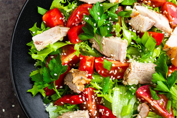 Salad with meat. Fresh vegetable salad with baked meat. Meat salad with fresh vegetables on plate