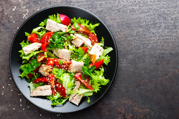 Salad with meat. Fresh vegetable salad with baked meat. Meat salad with fresh vegetables on plate