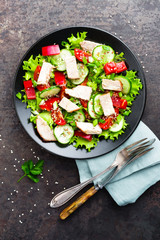 Salad with meat. Fresh vegetable salad with baked meat. Meat salad with fresh vegetables on plate