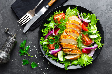 Salad with chicken meat. Fresh vegetable salad with chicken breast. Meat salad with chicken fillet and fresh vegetables on plate