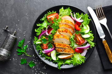 Salad with chicken meat. Fresh vegetable salad with chicken breast. Meat salad with chicken fillet and fresh vegetables on plate