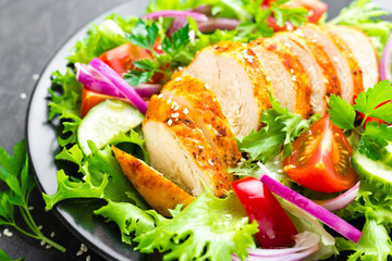 Salad with chicken meat. Fresh vegetable salad with chicken breast. Meat salad with chicken fillet and fresh vegetables on plate