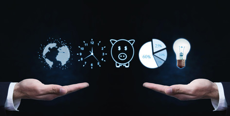 Hands holding globe, clock, piggy bank, pie graph and light bulb. Business concept