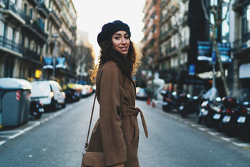 Fototapeta premium portrait of a modern well-dressed business woman rushing to meet a business partner. City background