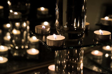Burring candles on decorative glass.