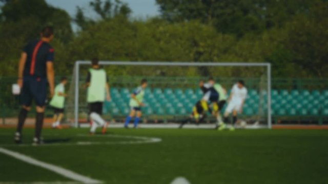 Football player scores a goal, the referee raises his hand, slow motion, football championship, goalkeeper misses goal