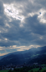 Obraz premium Stormy sky and sunbeam over Flums, Swiss Alps