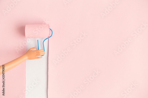 Close Up Of Doll Hand Coloring Wall In Pastel Pink By Using Painting Close Up Of Doll Hand Coloring Wall In Pastel Pink By Using Painting Roller Abstract