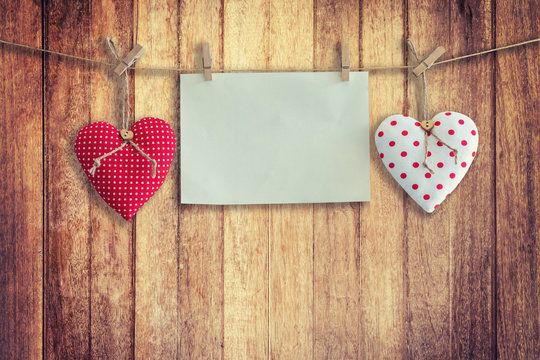 Heart and paper hanging on wood Background and Texture, Vintage toned.