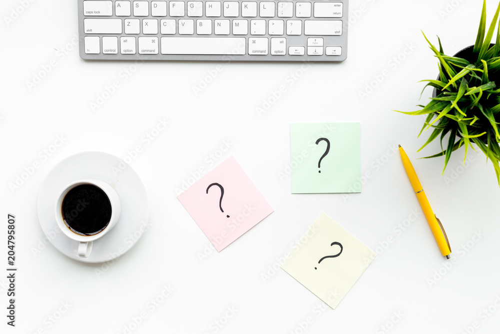 Poster question mark on sticky notes on office desk on white background top view. faq concept. working with