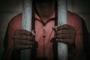 Hands of men desperate to catch the iron prison,prisoner concept,thailand people,Hope to be...