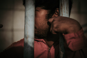 Hands of men desperate to catch the iron prison,prisoner concept,thailand people,Hope to be...