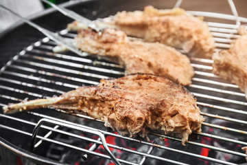 Cooking of appetizing juicy spare ribs outdoors