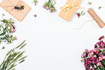 Flat lay frame composition with bright spring flowers