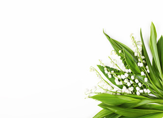 Beautiful bouquet of lilies of the valley isolated on white background. Top view with copy space. Flat lay