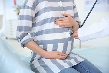 Gynecology consultation. Pregnant woman with her doctor in clinic