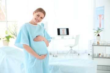 Fototapeta premium Gynecology consultation. Pregnant woman in modern clinic