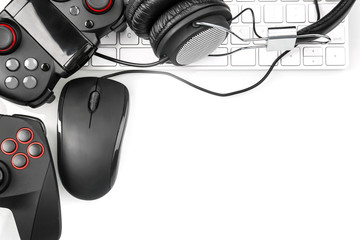 Flat lay composition with computer mouse and gaming gear on light background