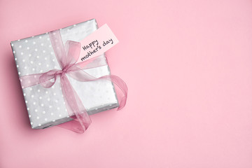 Elegant gift box for Mother's Day on color background, top view